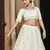 PEARL-WHITE SEQUINS EMBROIDERED GEORGETTE SEMI STITCHED BRIDAL LEHENGA