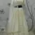 PEARL-WHITE SEQUINS EMBROIDERED GEORGETTE SEMI STITCHED BRIDAL LEHENGA