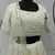 PEARL-WHITE SEQUINS EMBROIDERED GEORGETTE SEMI STITCHED BRIDAL LEHENGA