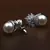 Rhodium Plated Pearl and American Diamond Embellished Earrings 216ED603