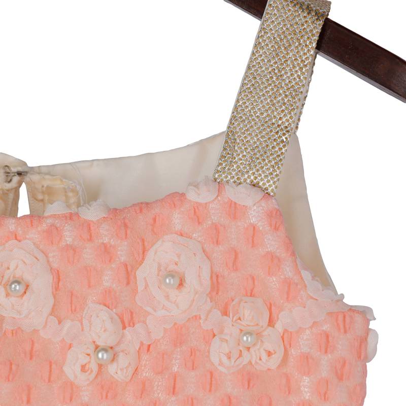 Lacy peach gown with golden bow