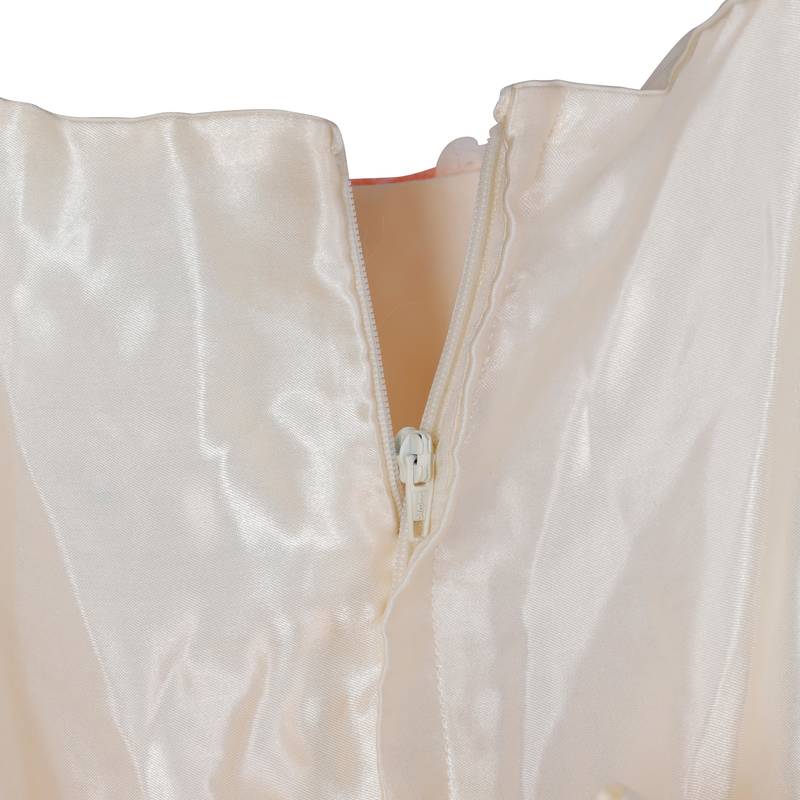 Lacy peach gown with golden bow