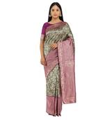Dark green woven silk saree with blouse