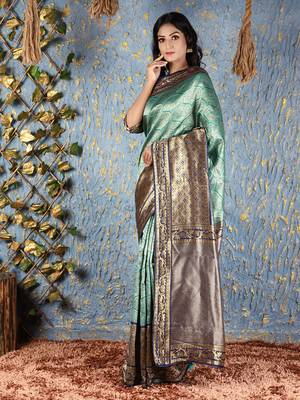 Teal woven silk blend saree with blouse 1