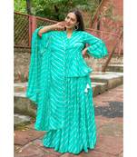 green pure hand tie and die lehenga with bijiya and white tassels