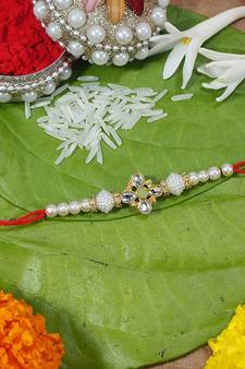 Gold Plated Ethnic Designer Pearl Rakhi Bracelet