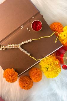 Hanging Kundan Studded Pearl Lumba Rakhi for Bhabhi 