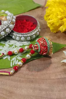 Gold Plated Enamel Hanging Pearl Jhumki Lumba Rakhi for Bhabhi
