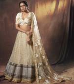 Beige embroidered net semi stitched Pary wear lehenga