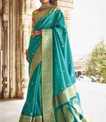 Turquoise embroidered pure silk saree with blouse