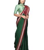 Dark green woven art silk saree with blouse