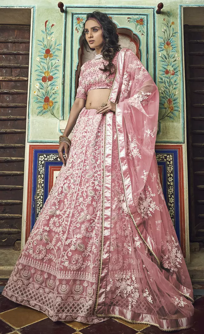 Peach thread embroidered net semi stitched lehenga