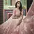 Peach thread embroidered net semi stitched lehenga