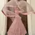 Peach embroidered net semi stitched bridal lehenga