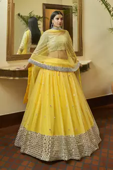 Yellow embroidered net semi stitched bridal lehenga