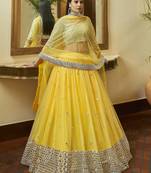 Yellow Gota and Zari embroidered with mirror work net Semi Stitched Bridal Lehenga
