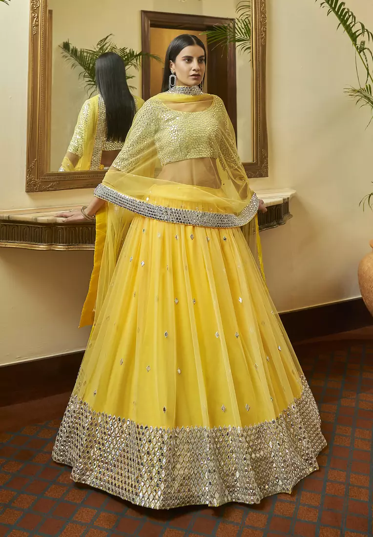 Yellow embroidered net semi stitched bridal lehenga