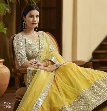 Yellow Gota and Zari embroidered with mirror work net Semi Stitched Bridal Lehenga 3