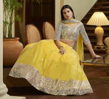 Yellow Gota and Zari embroidered with mirror work net Semi Stitched Bridal Lehenga 4