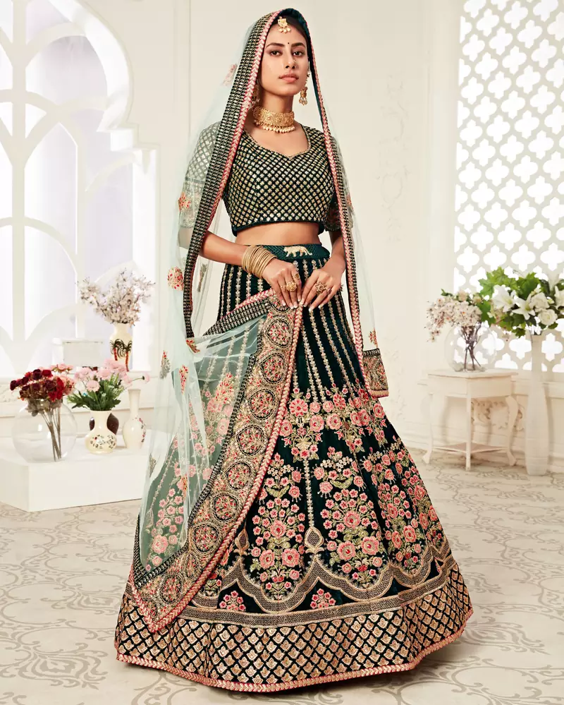 Exotic Dark Green Velvet Heavily Embroidered Wedding Bridal Lehenga Choli with Diamond Work