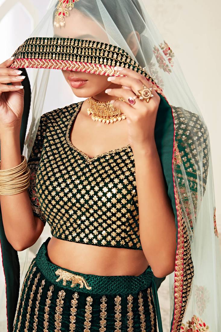 Exotic Dark Green Velvet Heavily Embroidered Wedding Bridal Lehenga Choli with Diamond Work