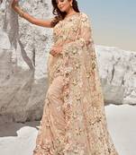 Peach embroidered net saree with blouse