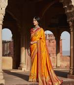 Orange woven banarasi silk saree with blouse