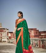 Green woven banarasi silk saree with blouse