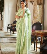 Light green woven silk blend saree with blouse