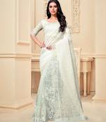 White embroidered fancy fabric saree with blouse
