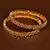 Gold plated gheru stone embellished copper made  bangles BD495