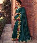 Teal embroidered georgette saree with blouse