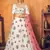 White thread with sequins embroidered net semi stitched party lehenga