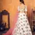 White thread with sequins embroidered net semi stitched party lehenga