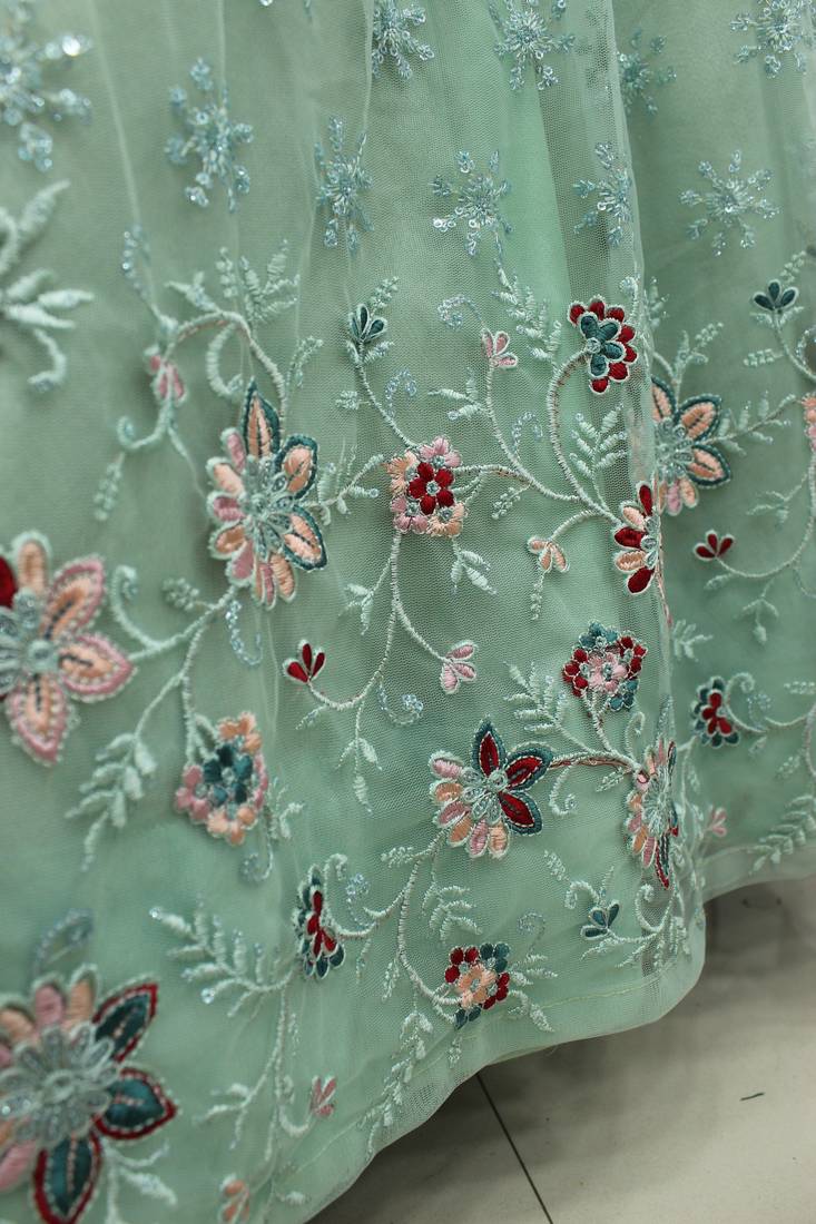 Mint green thread with sequins embroidered net semi stitched wedding lehenga