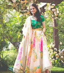 Engrossing Cream Floral Designer Lehenga with rich embroidered Green Blouse and Dupatta