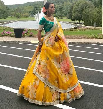 yellow floral organza lehenga with green embroidered choli 1