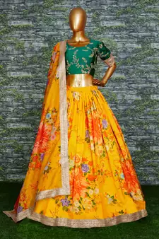 yellow floral organza lehenga with green embroidered choli