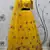 Yellow embroidered net semi stitched ceremonial lehenga