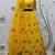 Yellow embroidered net semi stitched ceremonial lehenga