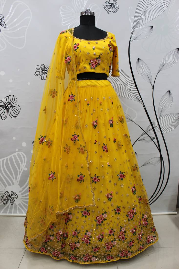 Yellow embroidered net semi stitched ceremonial lehenga