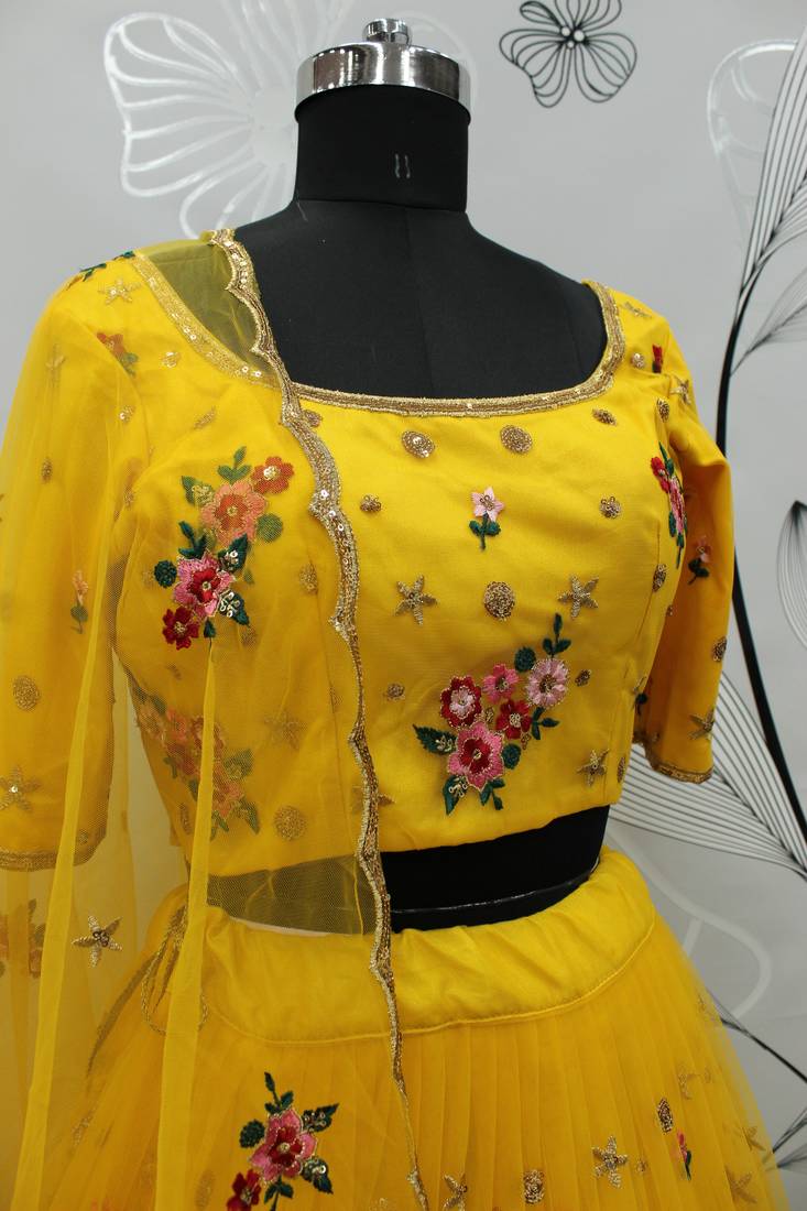 Yellow embroidered net semi stitched ceremonial lehenga