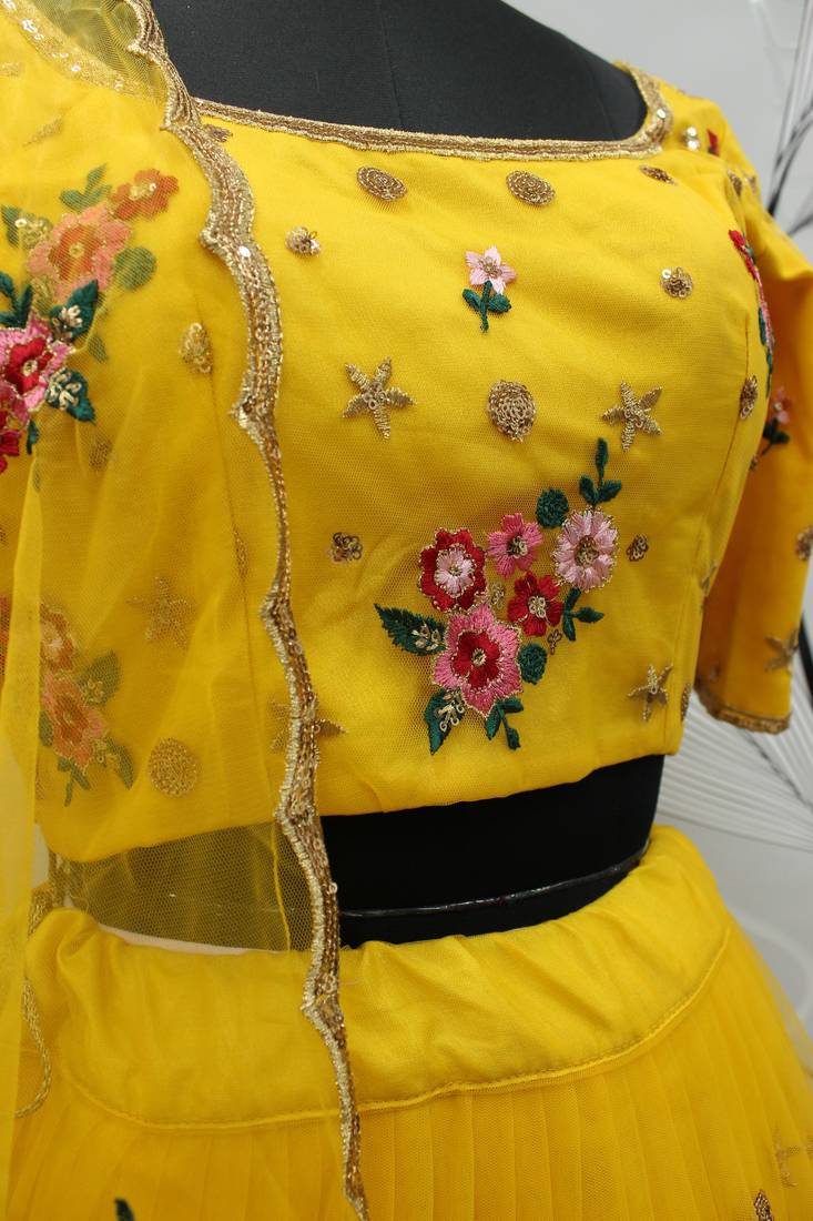 Yellow embroidered net semi stitched ceremonial lehenga