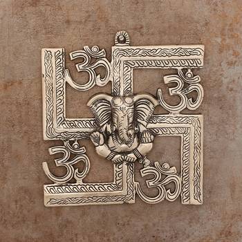 silver metal wall hanging with ganesha figurine and om-symbol motif 1
