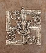 silver metal wall hanging with ganesha figurine and om-symbol motif