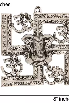 silver metal wall hanging with ganesha figurine and om-symbol motif