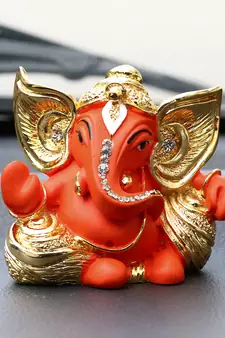 eCraftIndia Gold Plated Orange Kaan Ganesha DECORative Showpiece for Home Temple Office Car Dashboard