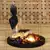 eCraftIndia Golden Meditating Buddha DECORative Showpiece with Wooden Base  Fragranced Petals and Tealight