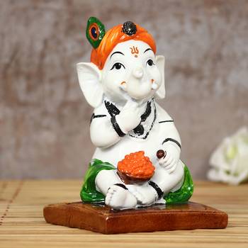 eCraftIndia DECORative Lord Ganesha eating Ladoo in Lord Krishna Avatar 1