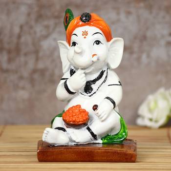 eCraftIndia DECORative Lord Ganesha eating Ladoo in Lord Krishna Avatar 2
